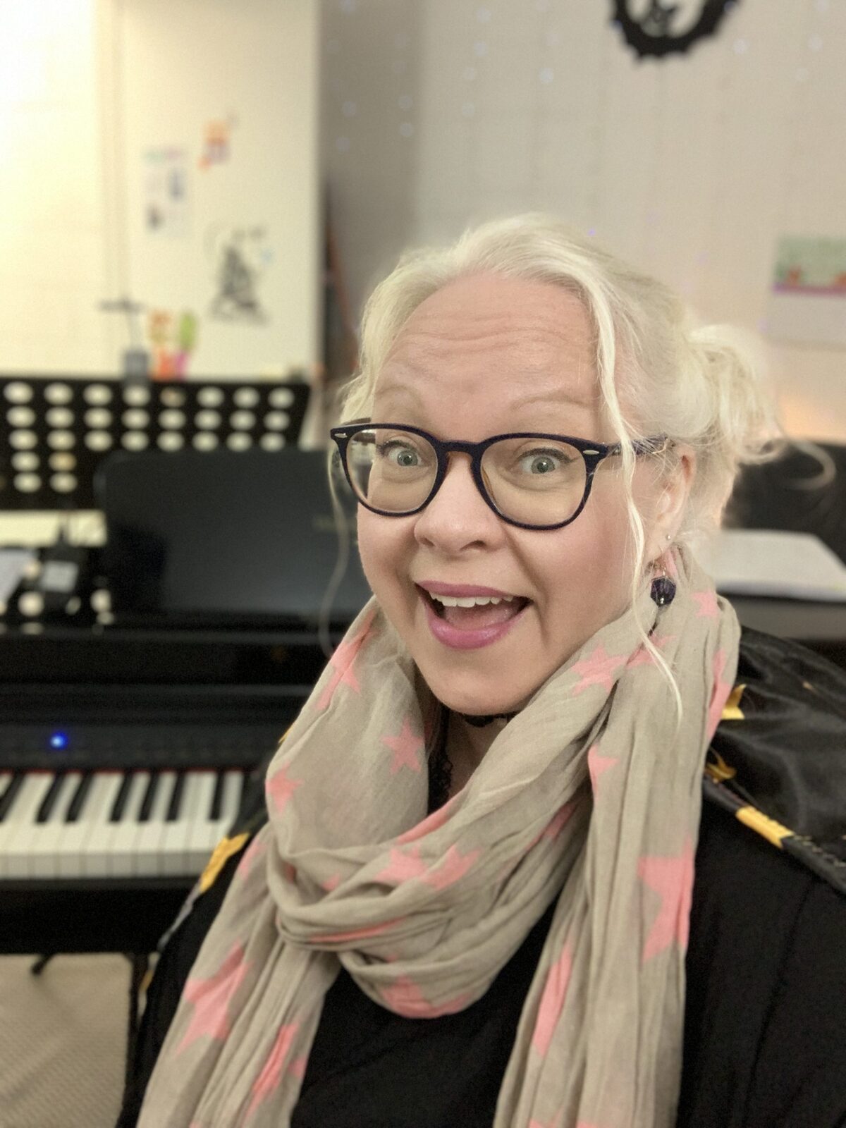 Katie Ditschun at the piano in her teaching studio